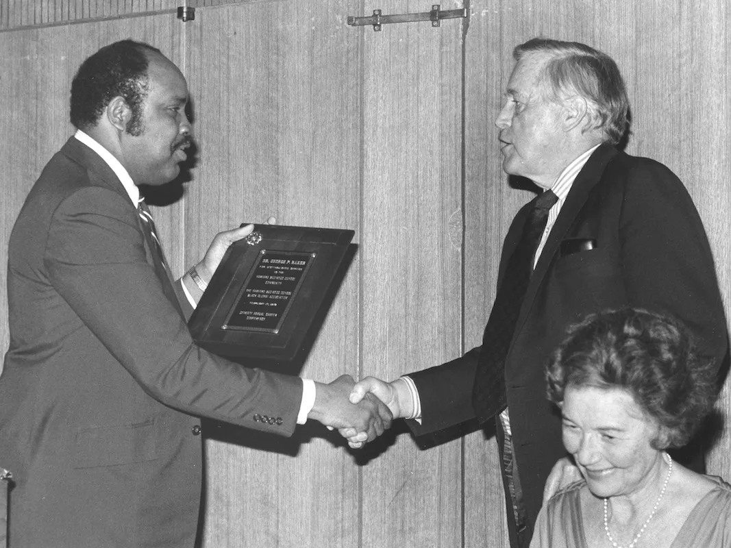 Black Alumni Association President Walter L. Ross presents former HBS Dean George P. Baker with the Distinguished Service Award, 1979