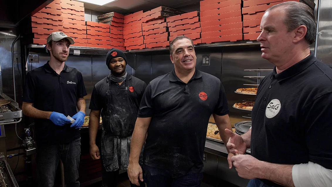 Sal Lupoli and others in kitchen of Sals pizza