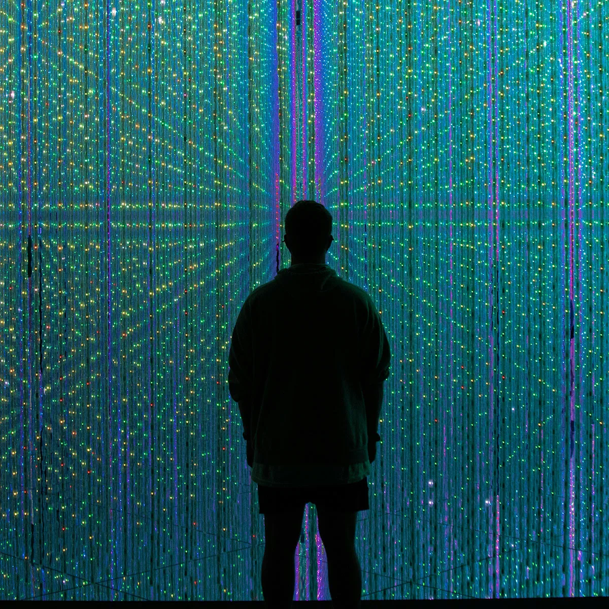 Person standing in front of lights