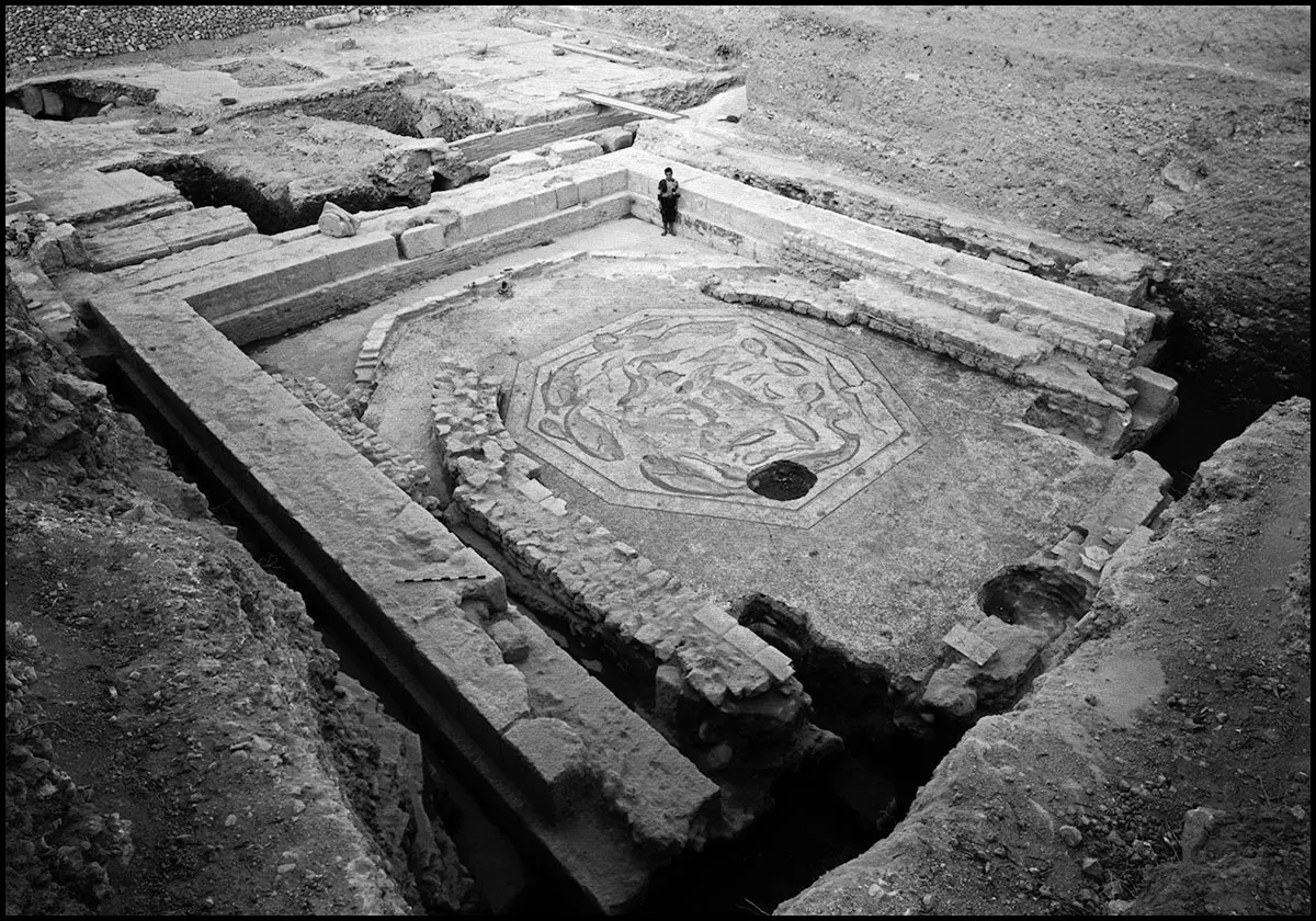 Archaeological site featuring the Tethys mosaic, an octagonal floor depicting the sea goddess surrounded by marine motifs within ancient stone ruins