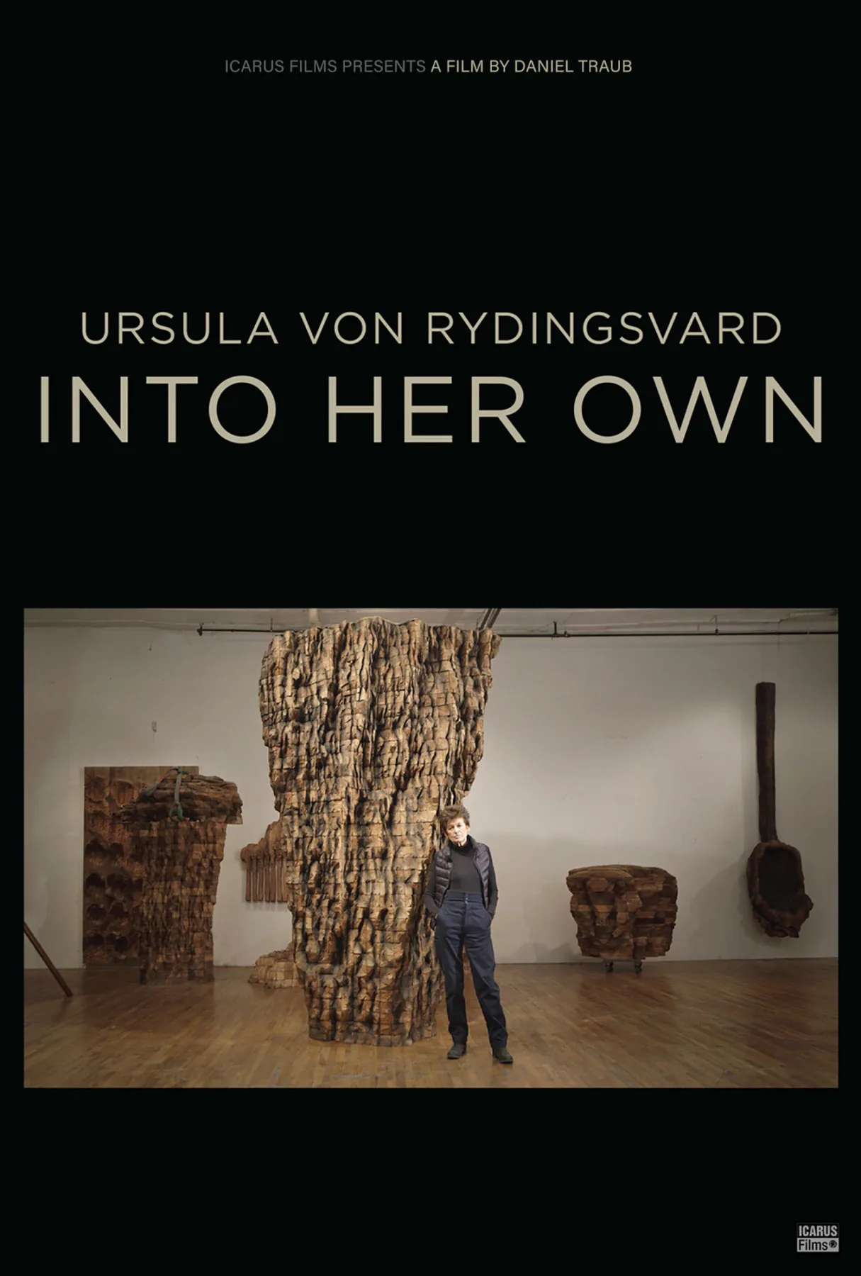 Icarus Films Presents A Film By Daniel Traub. Ursula von Rydingsvard. Into Her Own. Movie poster shows Ursula von Rydingsvard in front of artwork.