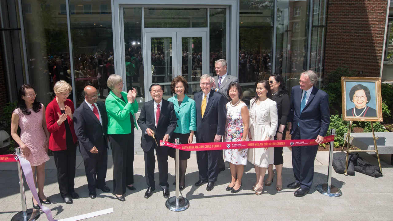 Dr. Chao and daughters with HBS Dean Nitin Nohria and dignitaries including Sen. Elizabeth Warren, Gov. Charlie Baker, and Sen. Ed Markey at ribbon-cutting celebration in front of Chao Center