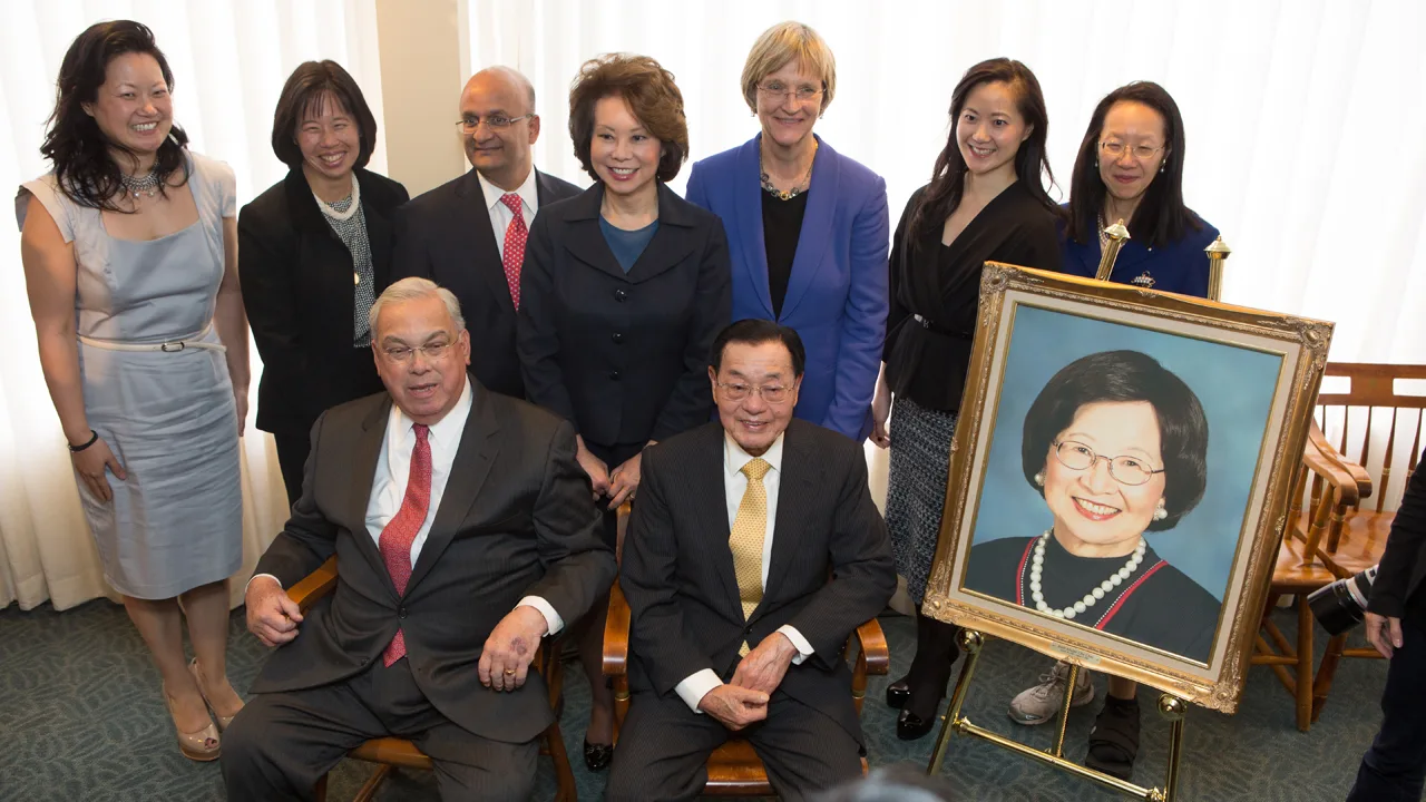 Dr. Chao and daughters with Harvard University President Drew Faust, Harvard Business School Dean Nitin Nohria, and former Boston Mayor Thomas Menino group photo next to portrait of Ruth Mulan Chu Chao at gift announcement