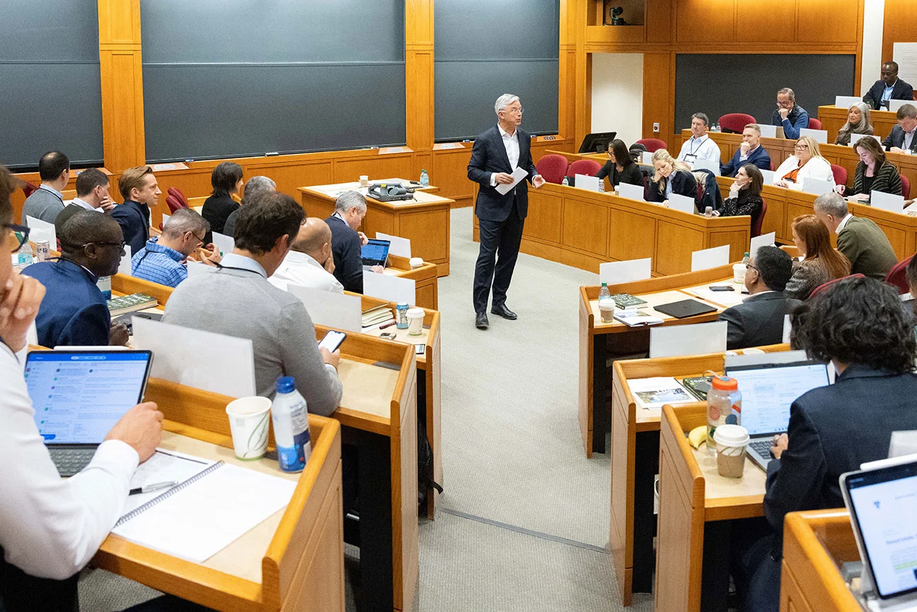 Faculty chair Hubert Joly lectures inside the classroom to executives attending the Growing as a Purposeful Leader program