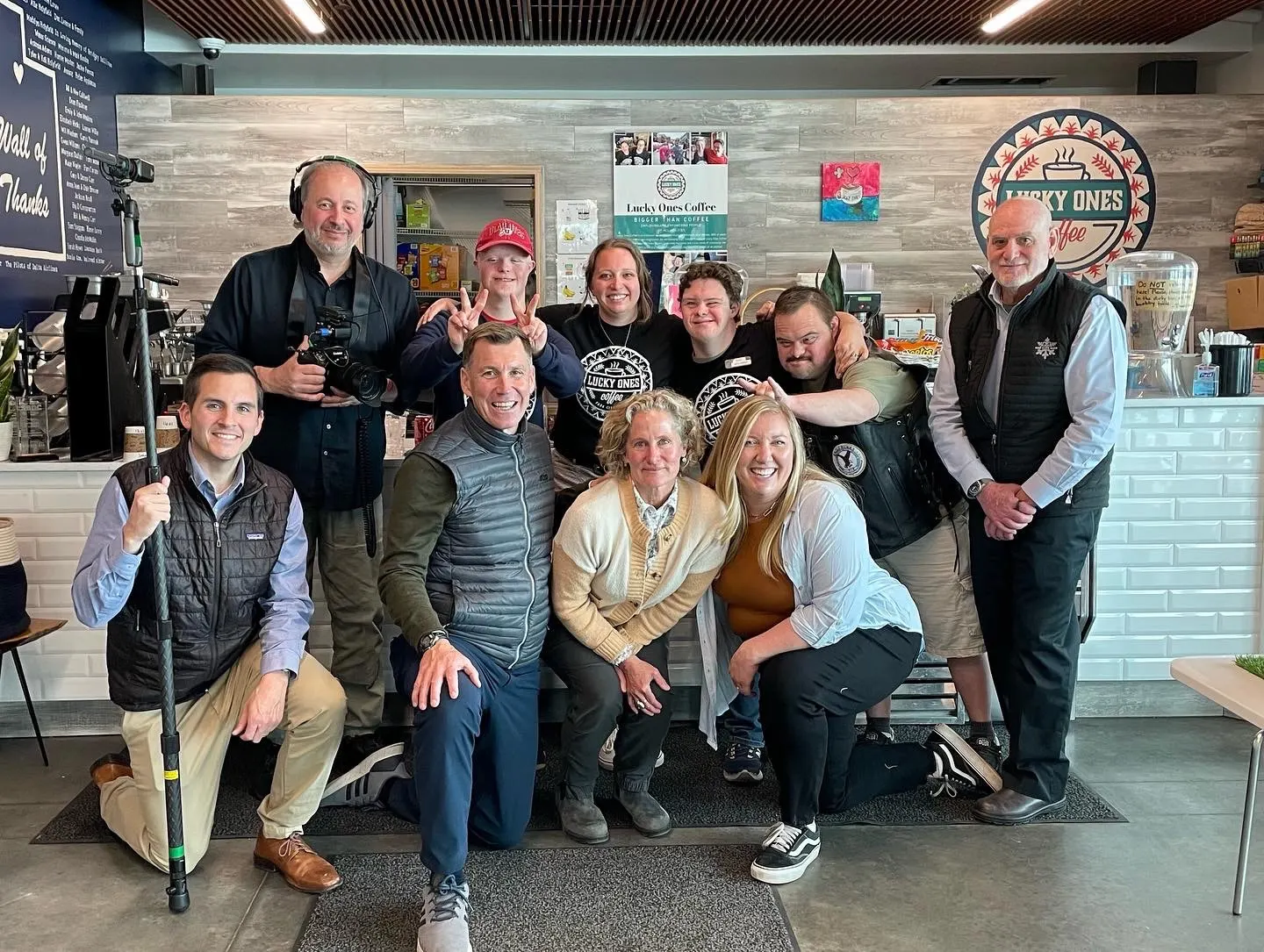 The multimedia team with employees of the Lucky Ones cafe.