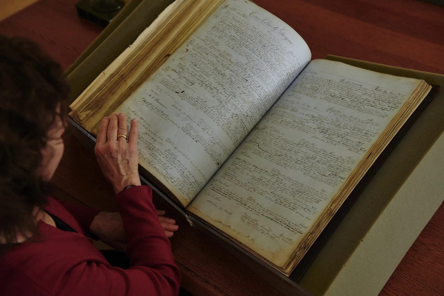 Open volume with woman hands on page