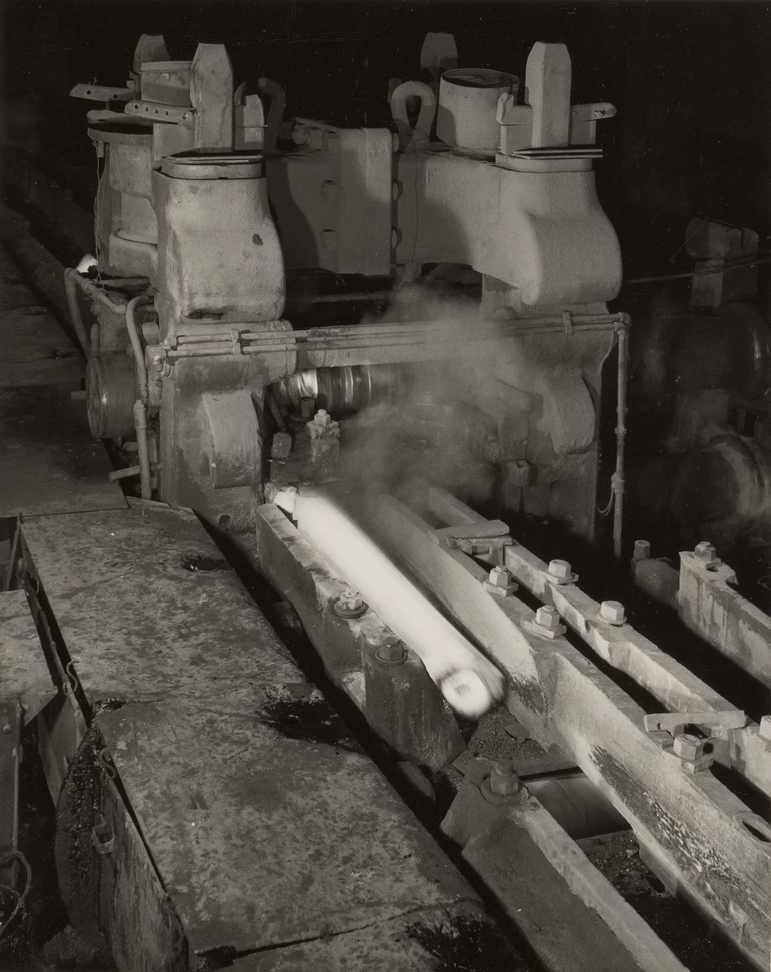 White-hot steel exits second stand of 32-inch billet mill during rolling process at Gary Steel Works.
