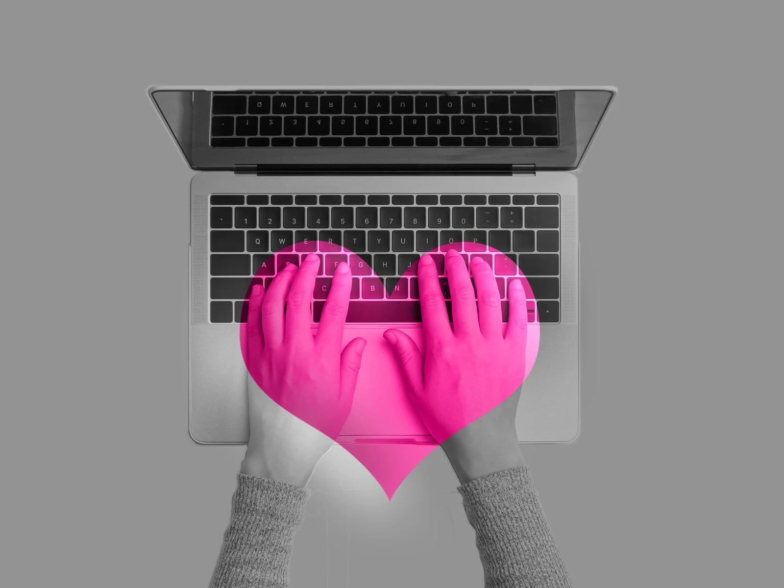 Hands over keyboard keys in black and gray, with pink heart overlay.