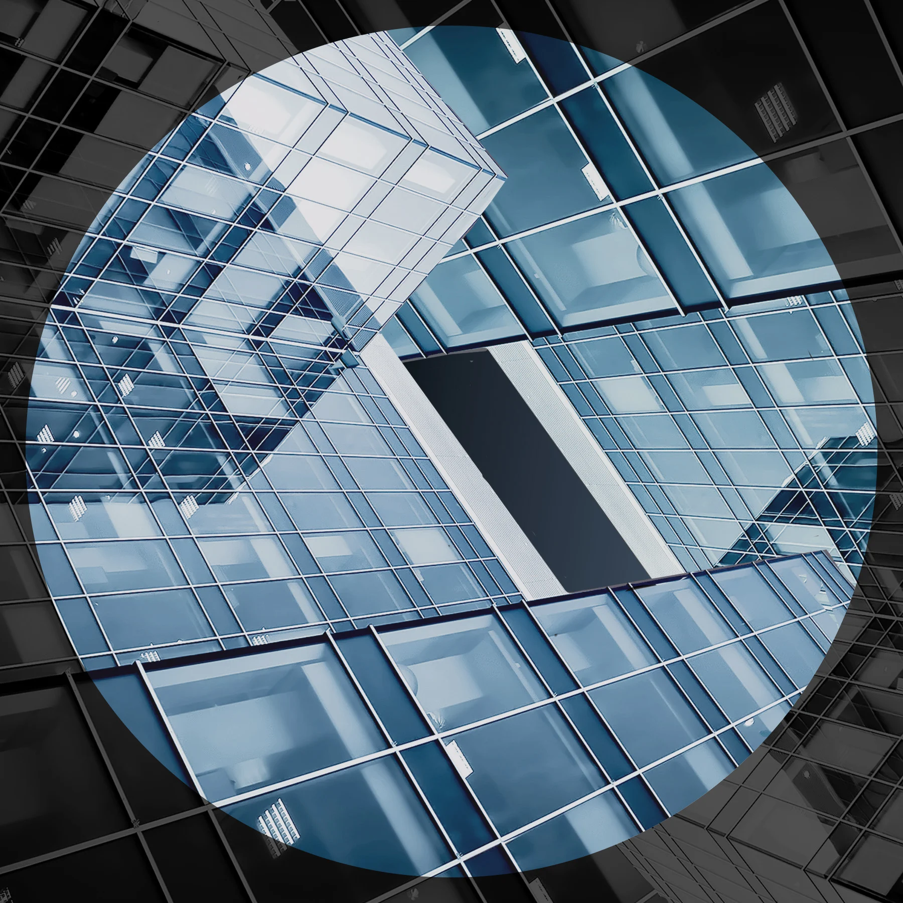 Low angle view of glass buildings intersecting.