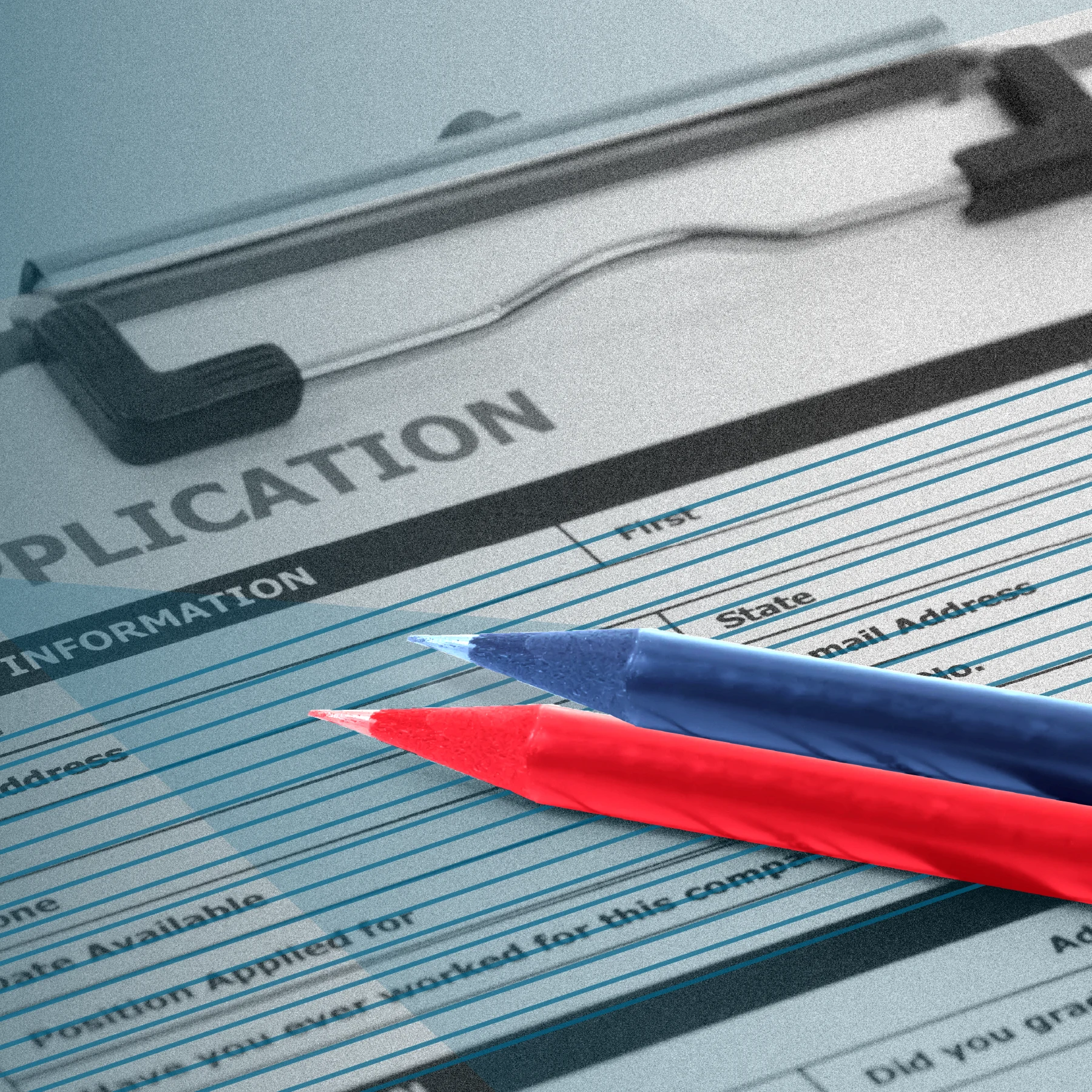 A close-up of a paper application form with the word “APPLICATION” visible, with red and blue pens sitting on top.