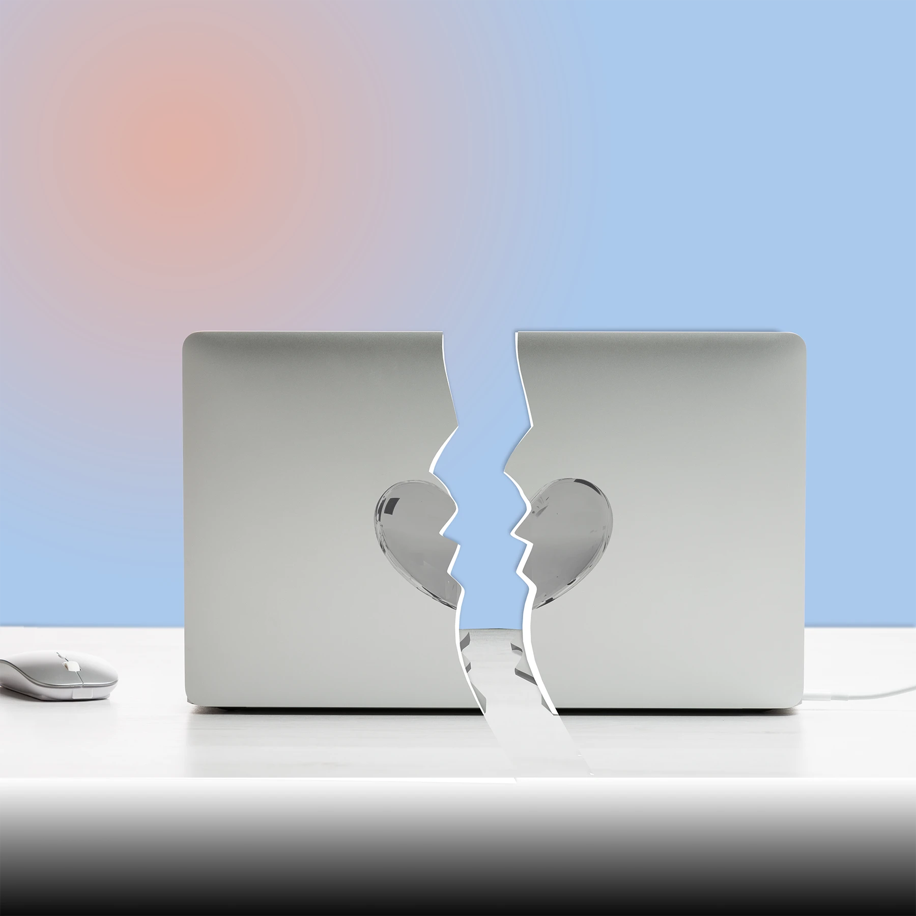 Computer with heart decal broken in half.