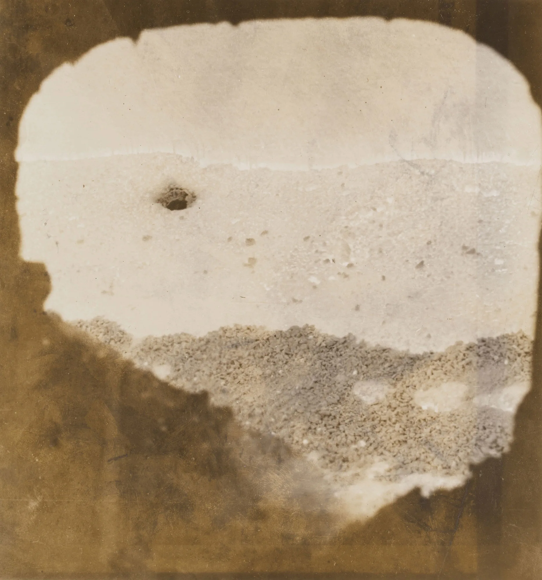 View through furnace door shows glowing “electric eye” inside active open hearth furnace at Gary Steel Works.