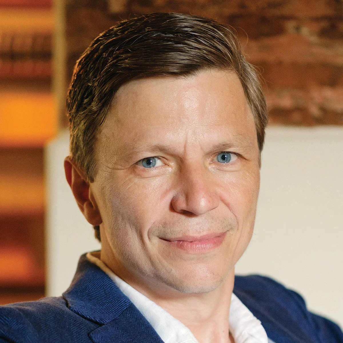 Jason Wild headshot in color, wearing business attire