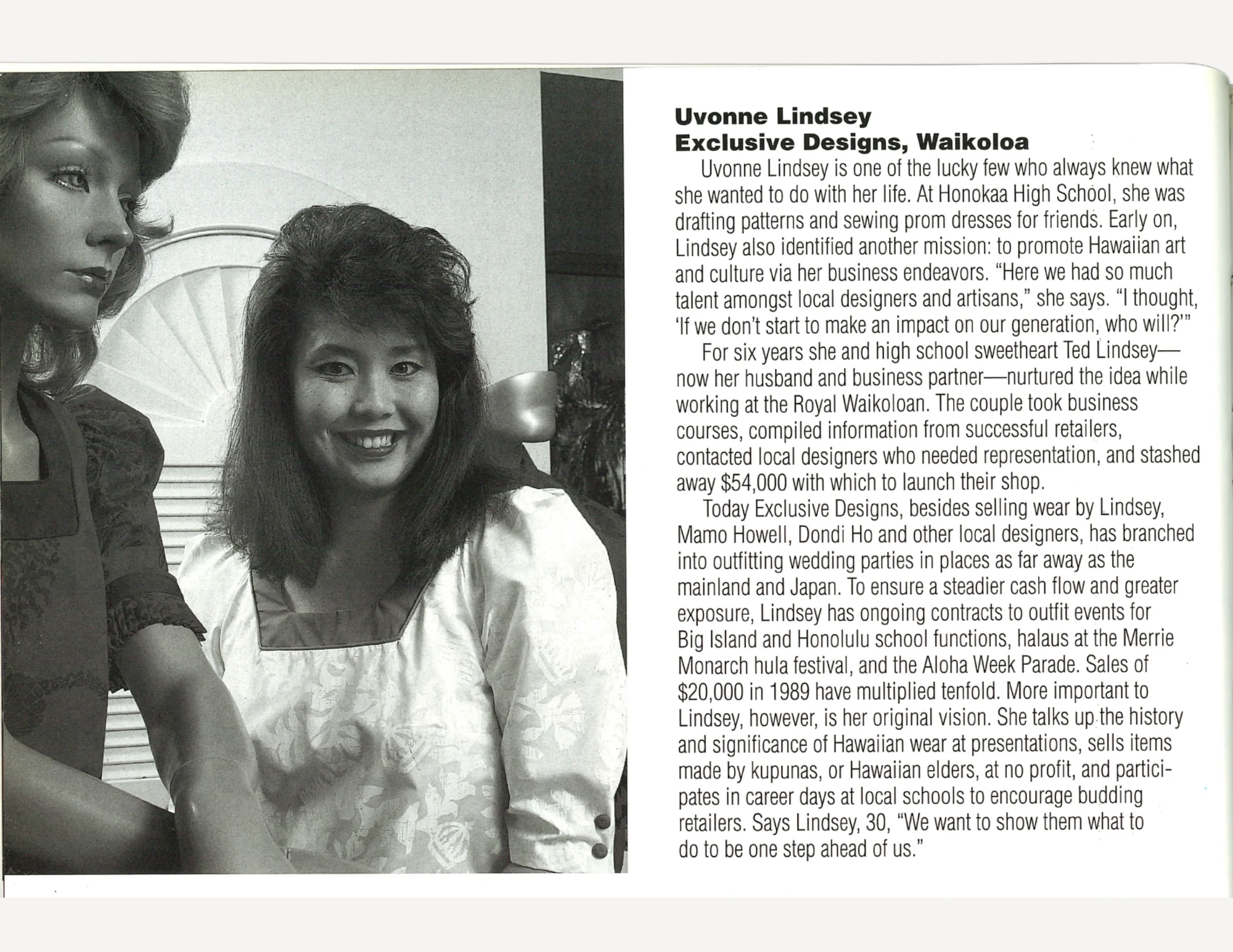 A woman with large hair in a light colored dress behind a mannequin, next to text