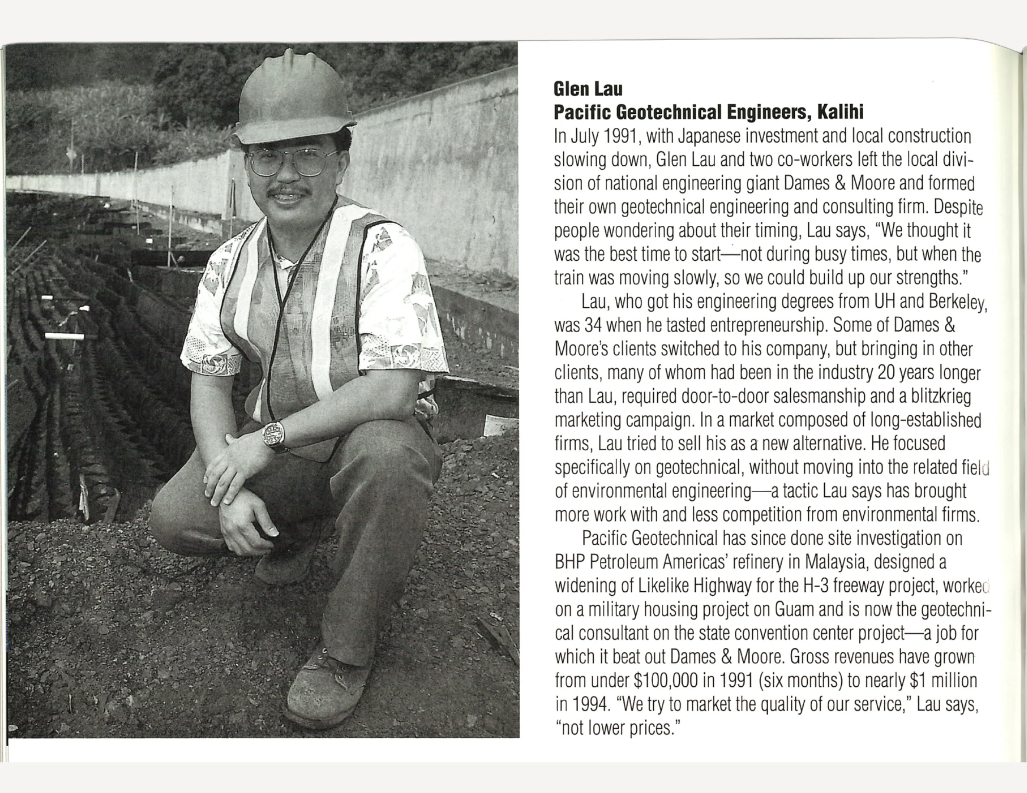 A man in glasses wearing construction gear squatting down next to a construction project, next to text