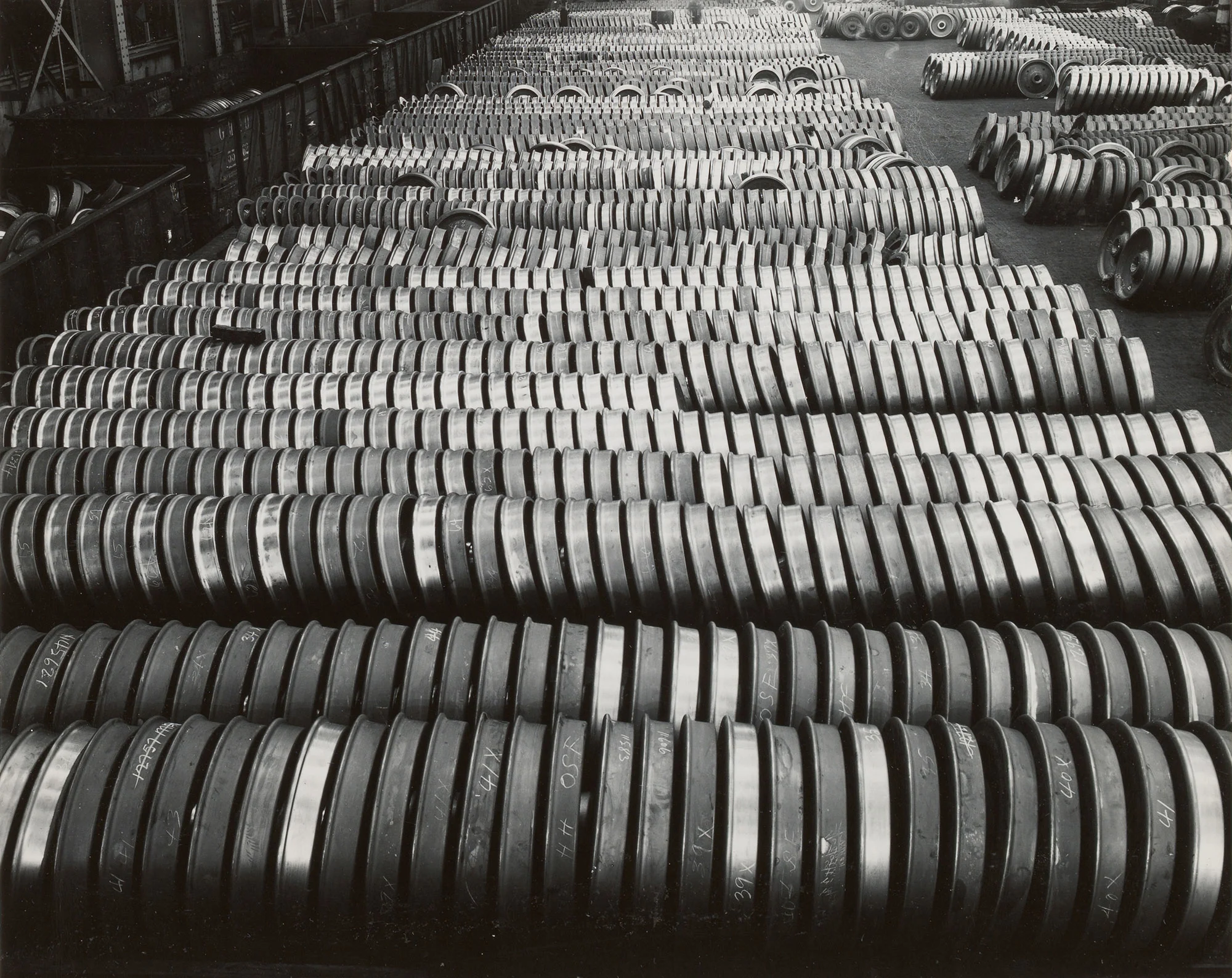 Hundreds of finished railroad wheels lined up for shipment at Gary Steel Works.