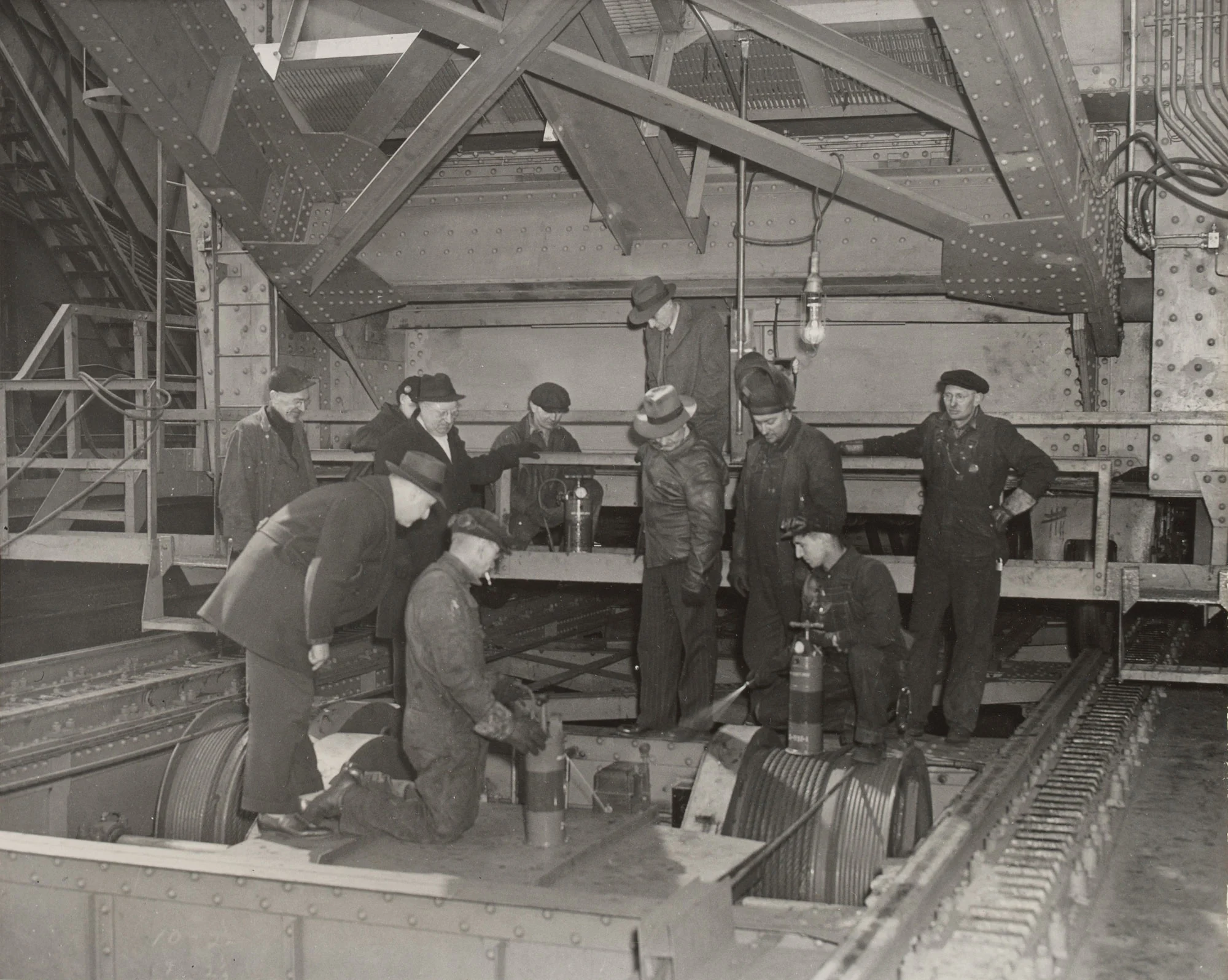 Ore bridge operators observe carbon tetrachloride fire extinguisher demonstration at Gary Steel Works.