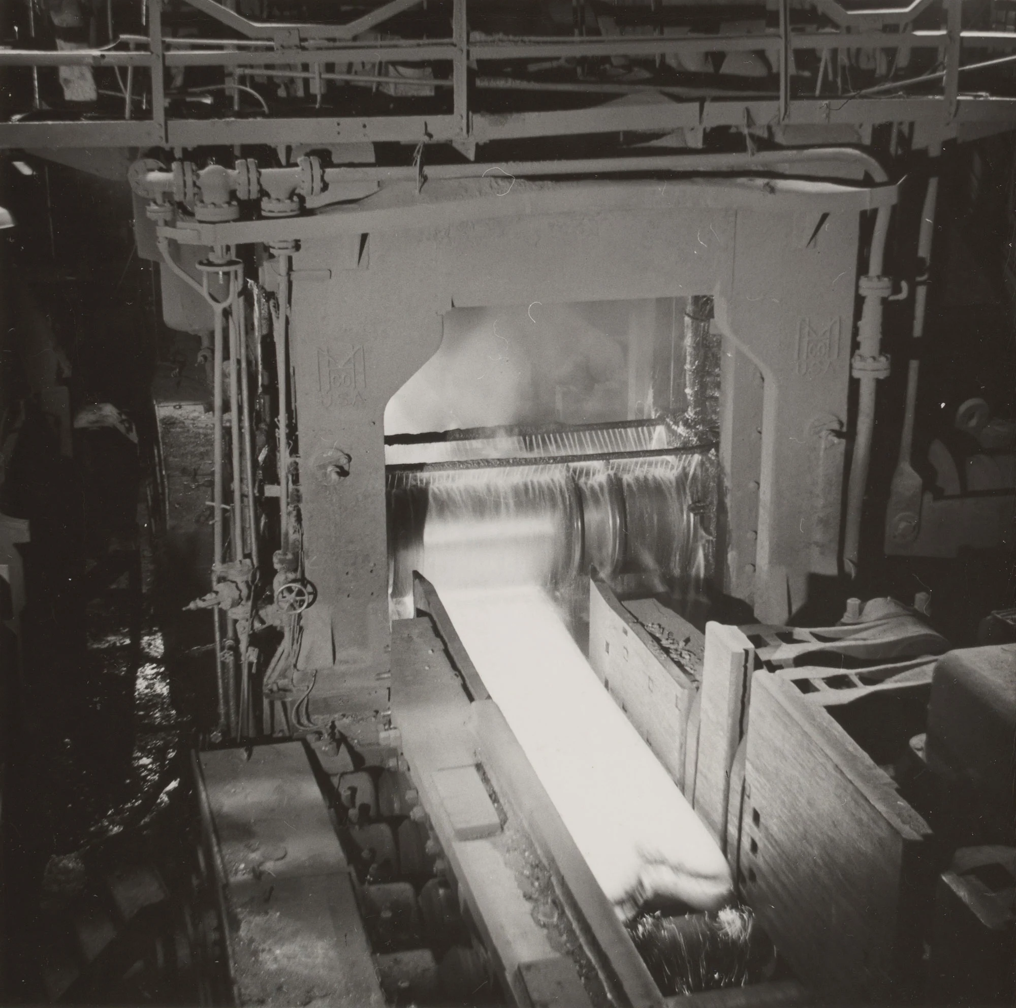 Bright steel ingot undergoes third rolling stage in 44-inch blooming mill at Gary Steel Works.