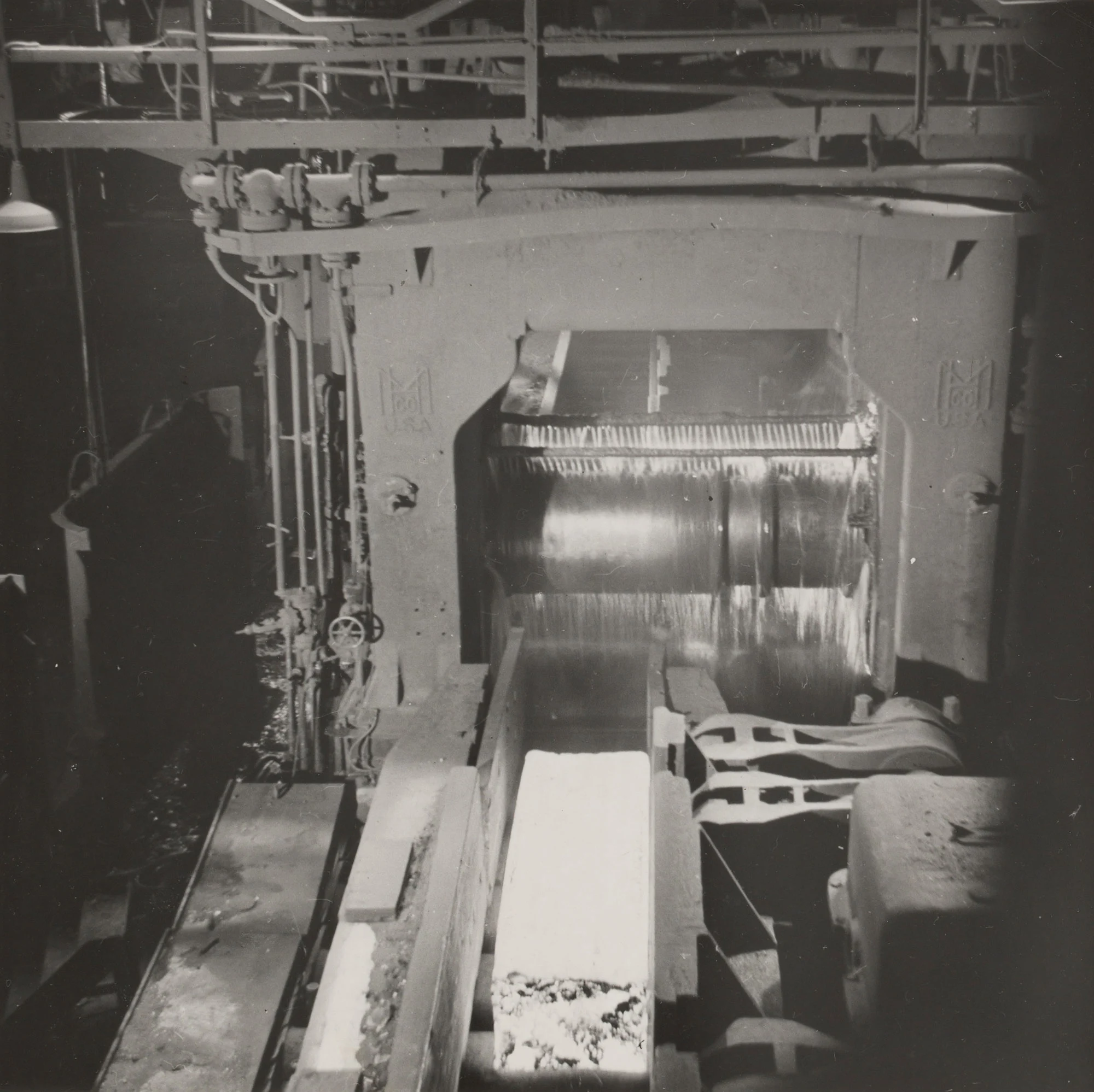 Glowing ingot enters 44-inch blooming mill for first rolling stage into slab at Gary Steel Works.