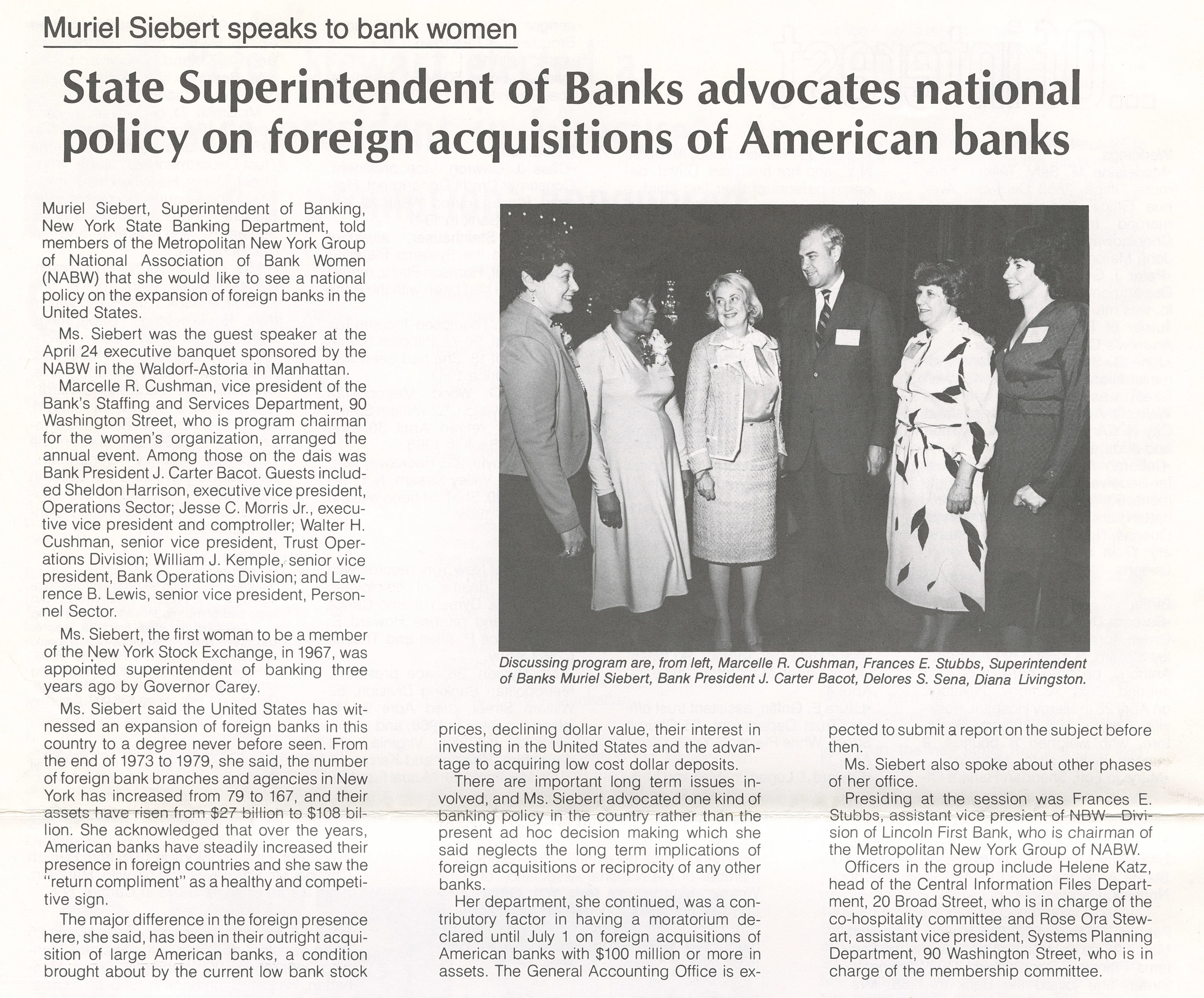 Muriel Siebert stands with NABW members and bank leaders at an executive banquet discussing U.S. banking policy.