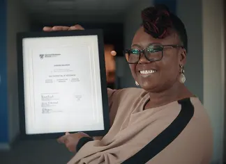 Online student with certificate