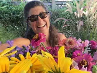 Liz with flowers grown in her garden