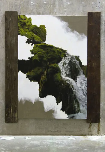 Oil painting of moss-covered rocks and cascading water, partially unfinished, framed by rustic wooden planks.