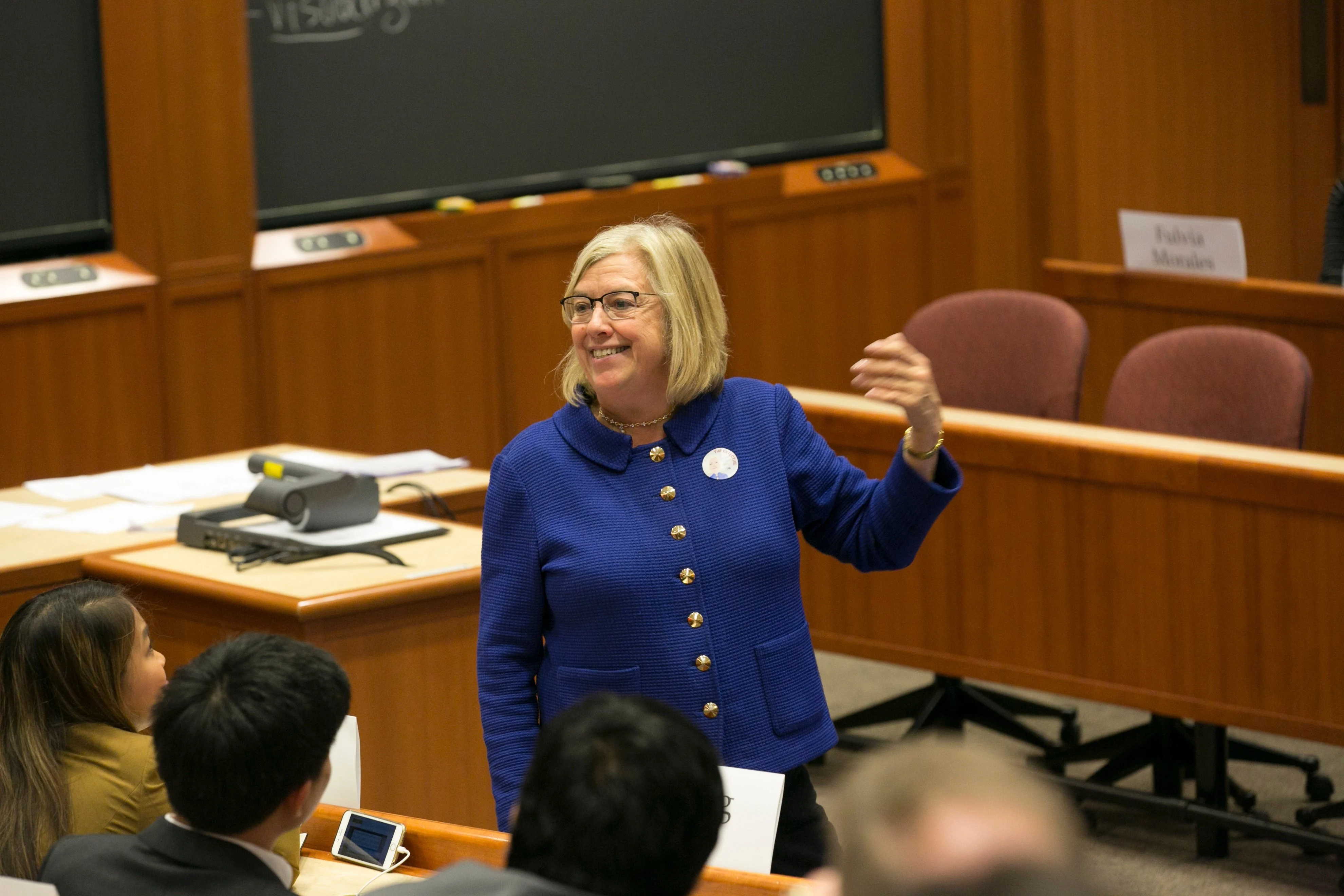 Professor Jan Hammond leads a case discussion at HBX ConneXt while dressed in her iconic blue suit