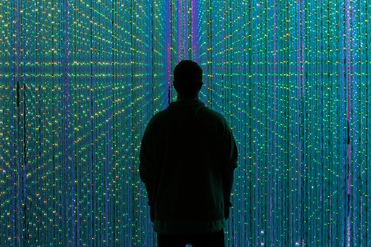Person standing in front of lights