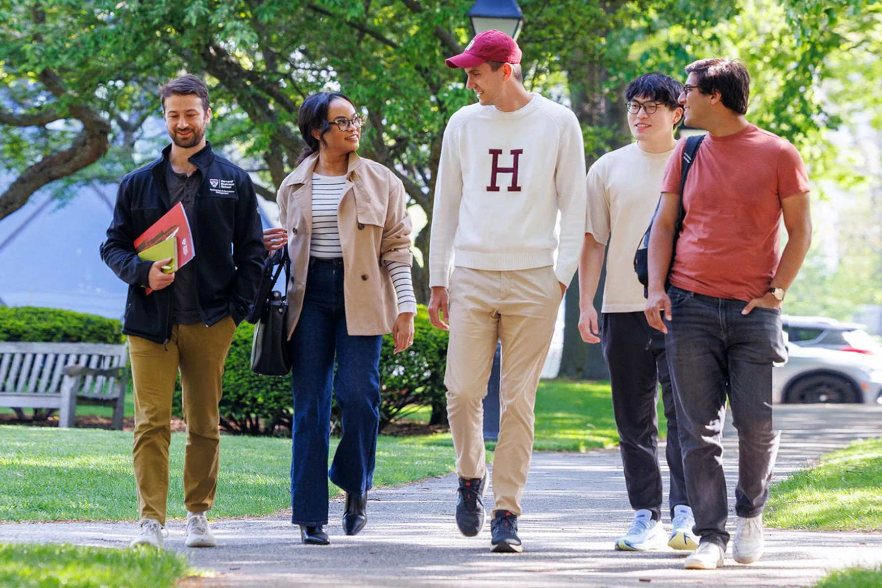 Doctoral students walking in front of Class of 1959 Chapel at Harvard Business School.