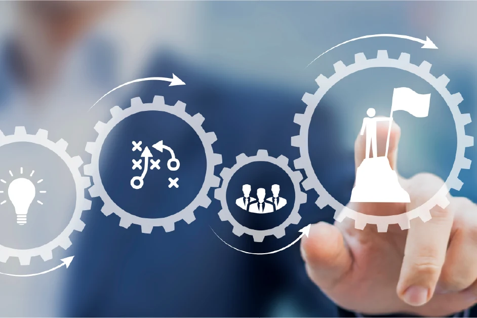 Person in a suit touches virtual gear icons representing strategy, teamwork, and goal achievement.
