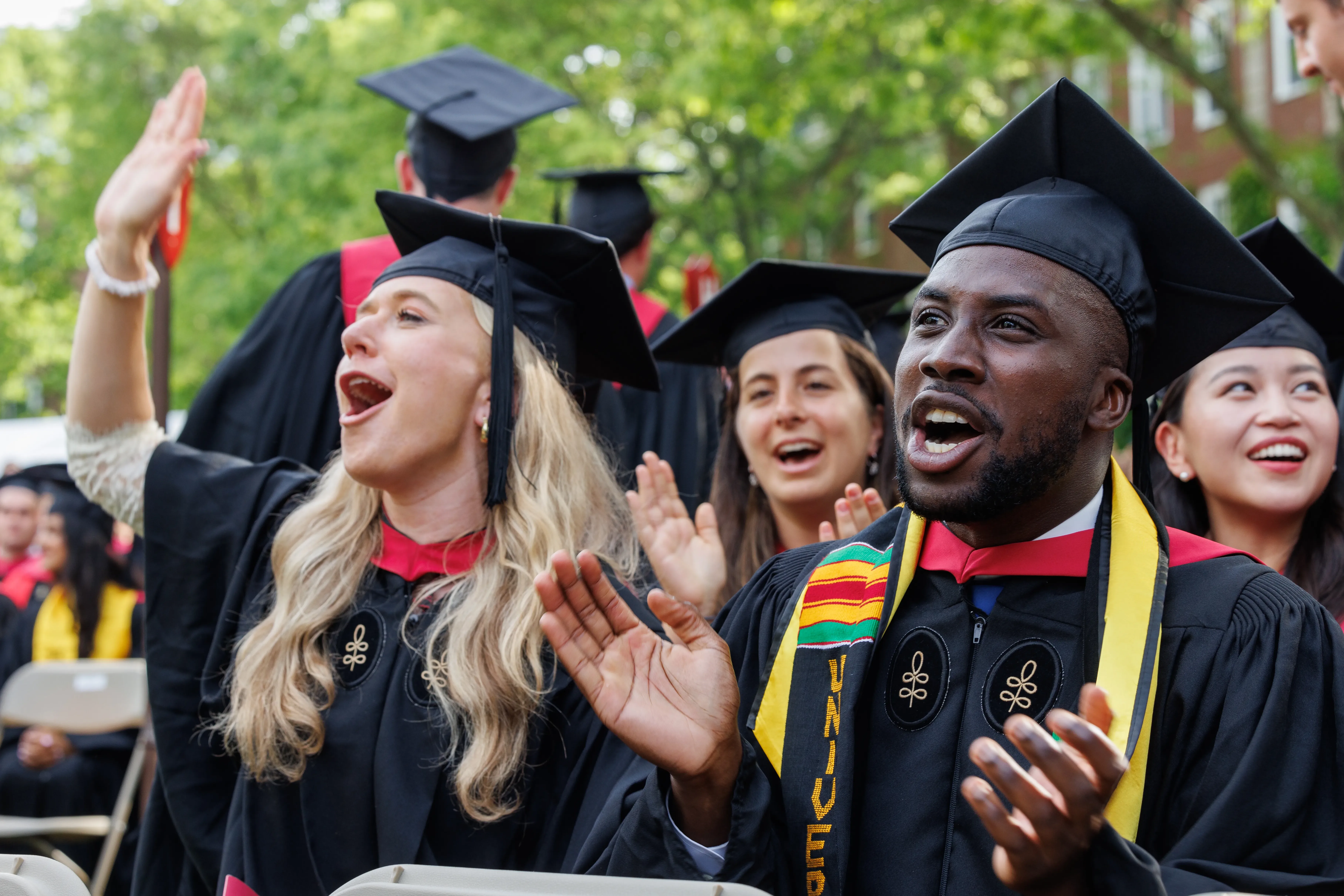 Graduates cheer from Baker Lawn