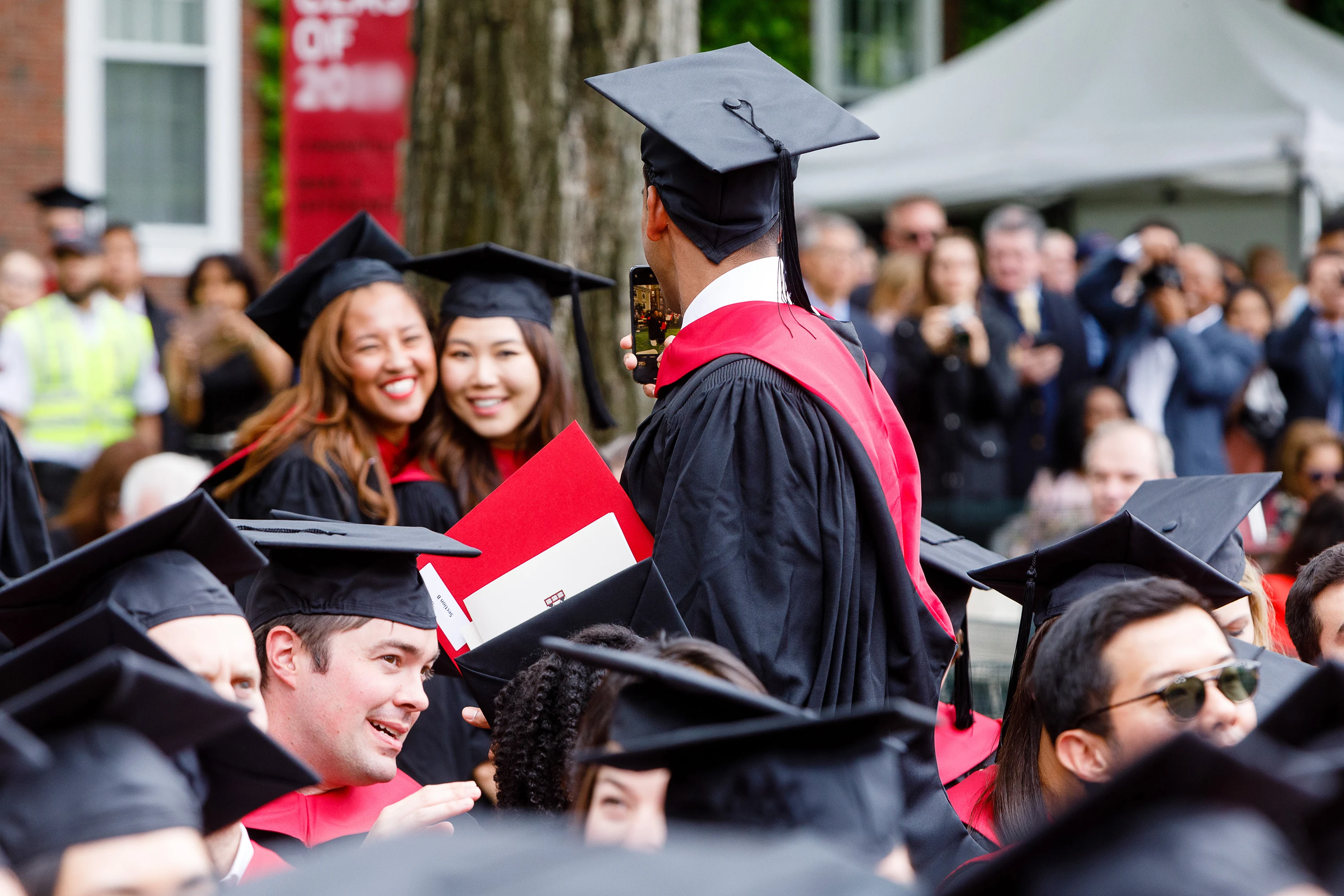 Graduating MBA students enjoying Commencement.