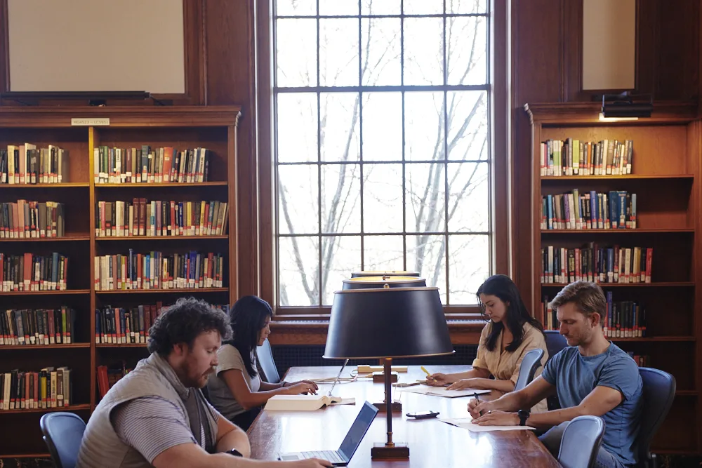 Shot of inside of Baker Library with students studying