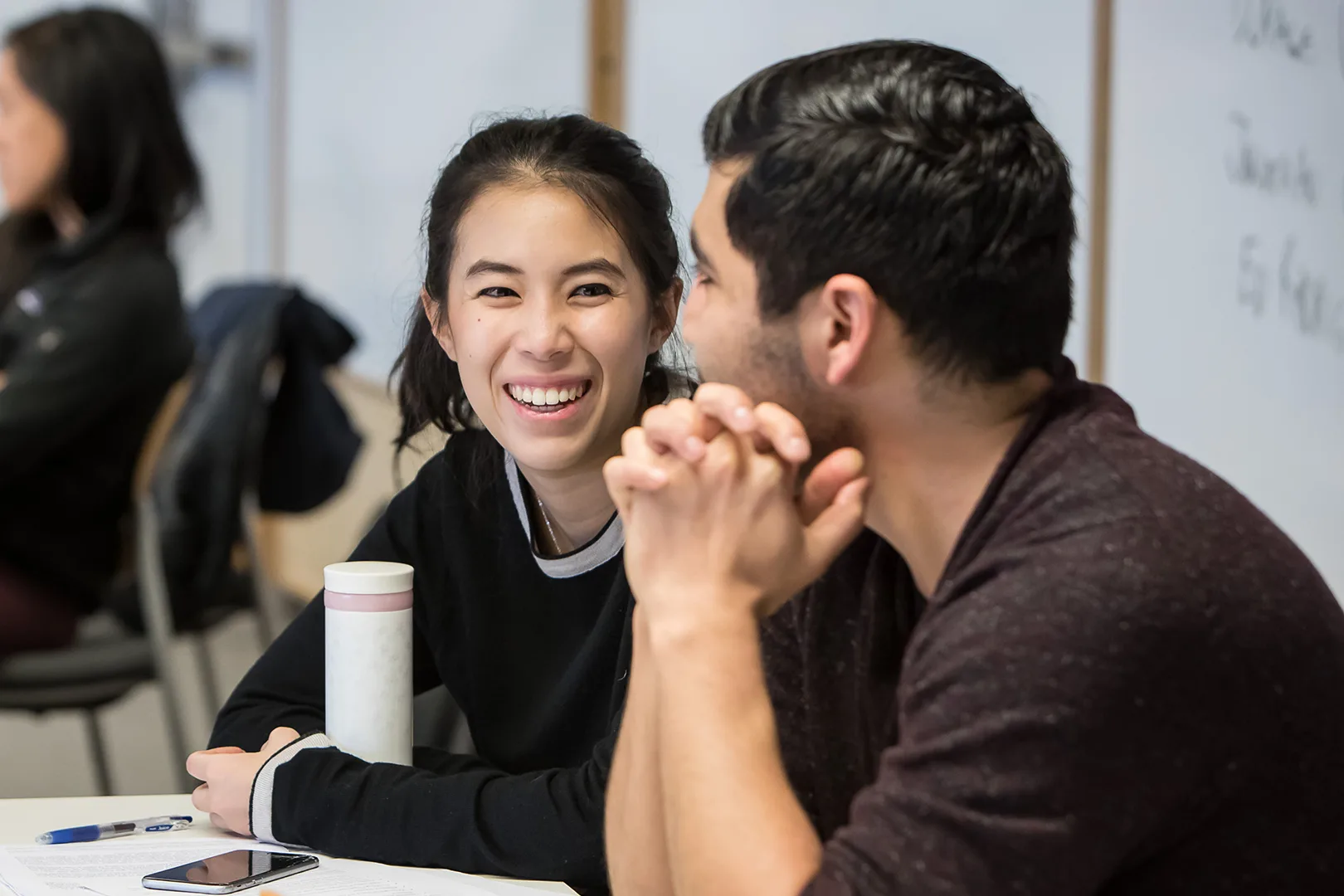 Students working together while laughing.