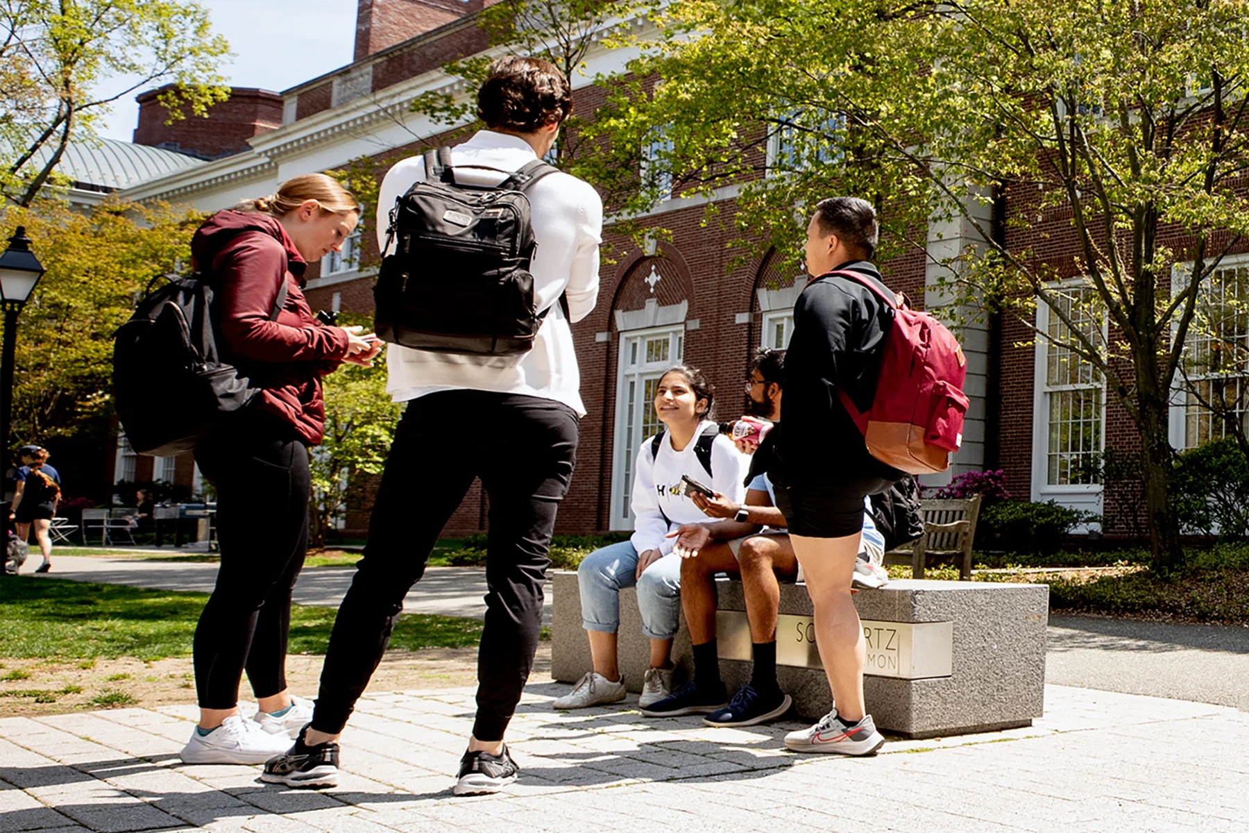 MBA students continue the discussion outside of Spangler Center.