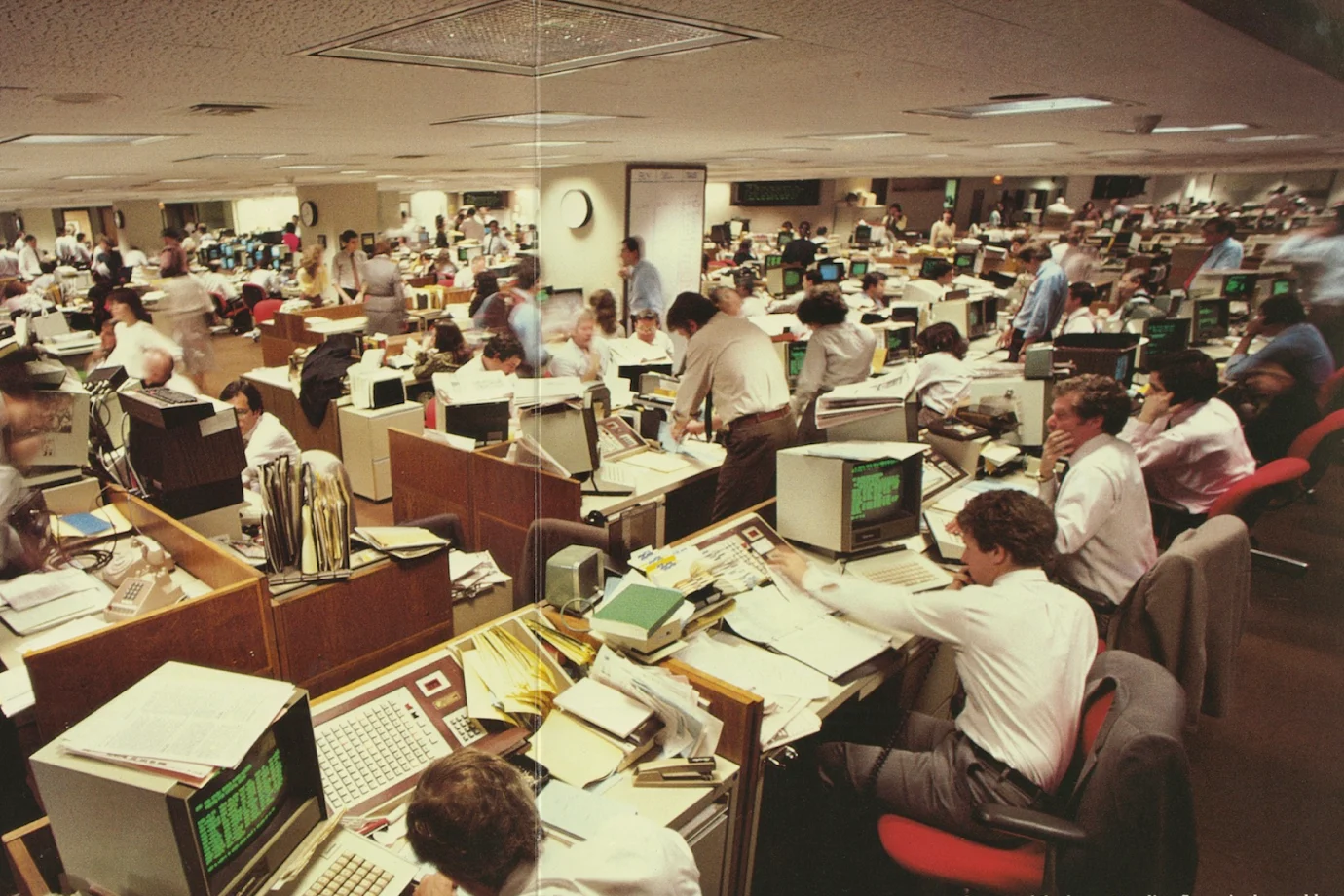 Room full of computers and people working