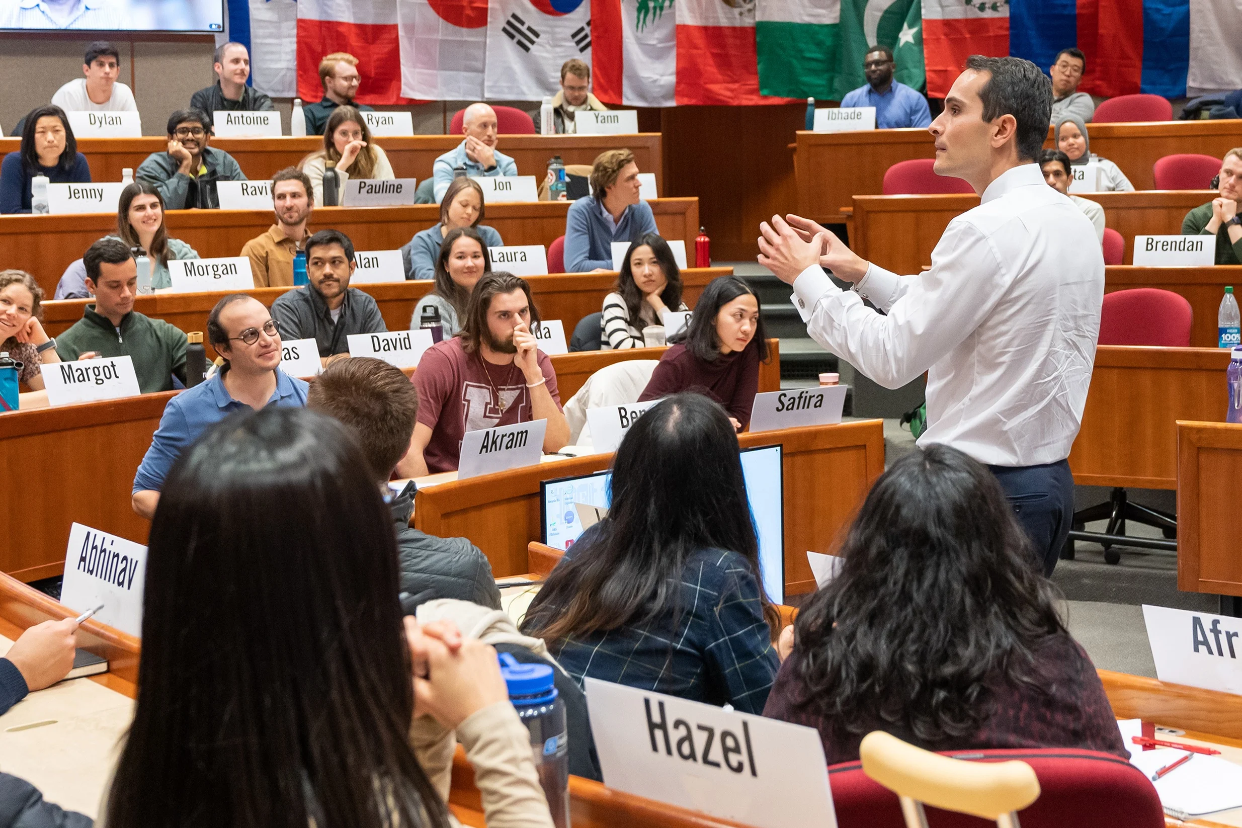 A professor leads MBA students in a case discussion.