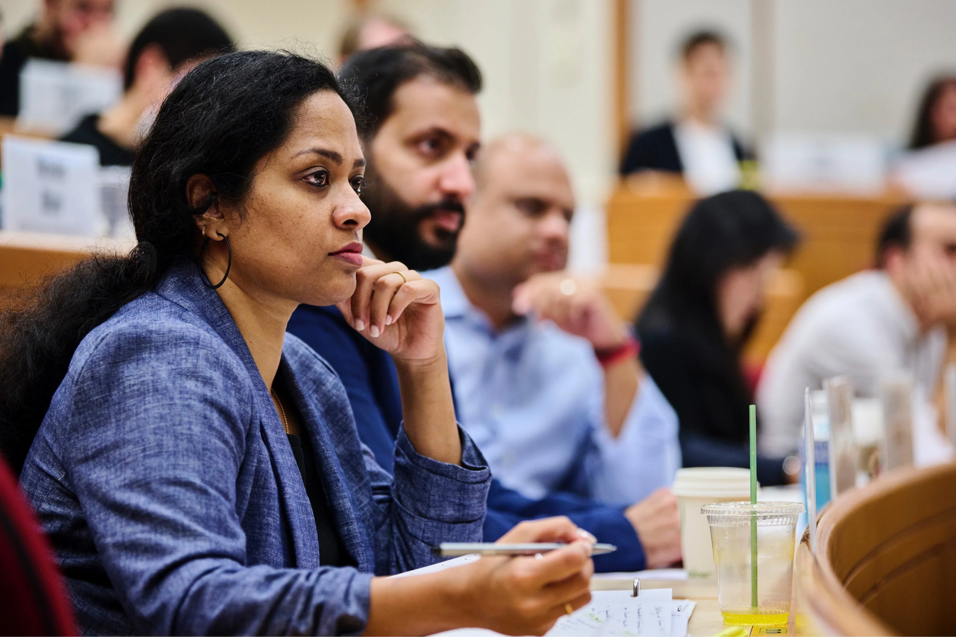 HBS students listen in a course