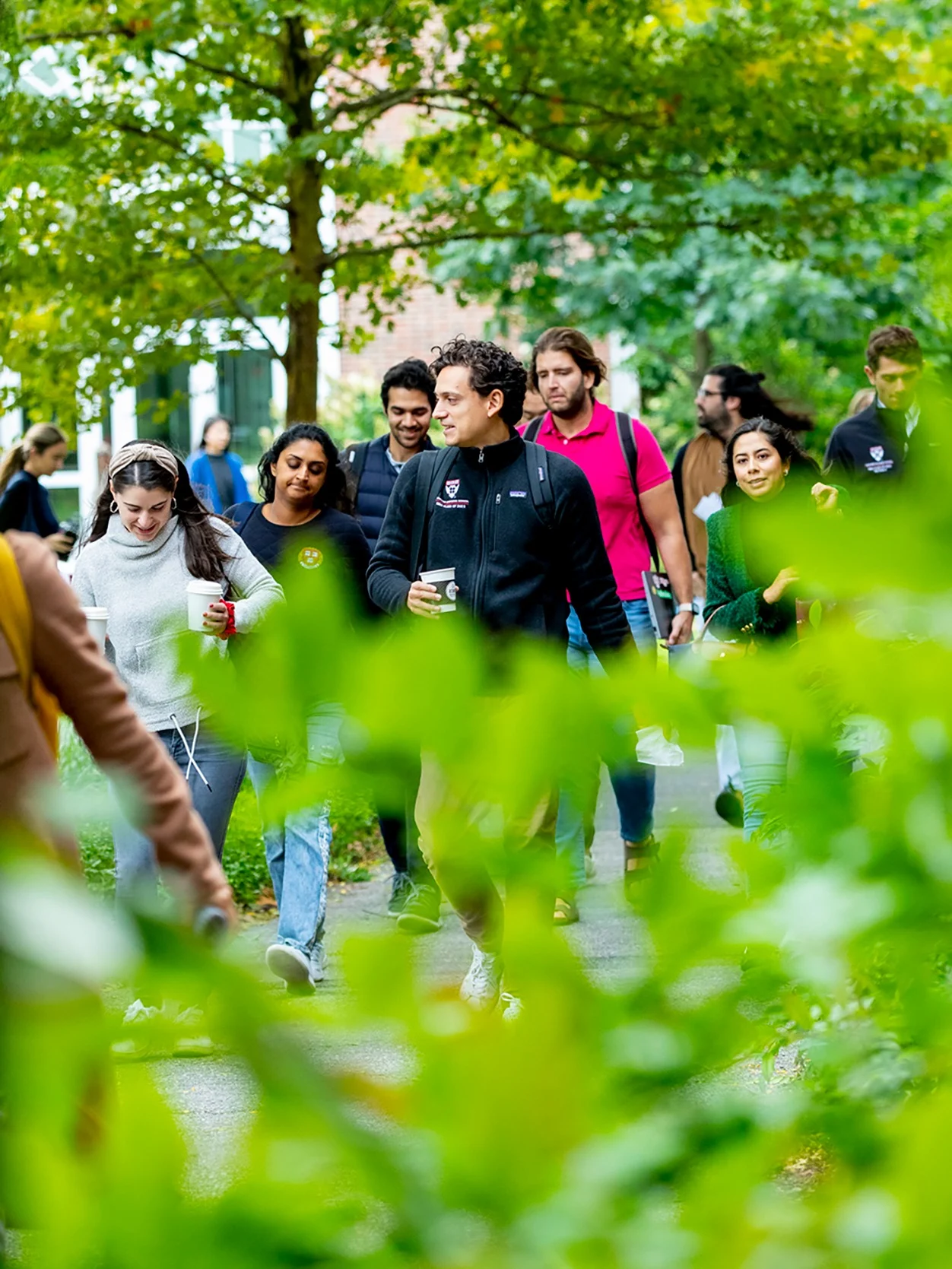 MBA students discuss the upcoming case discussion on their way to class in Aldrich Hall.