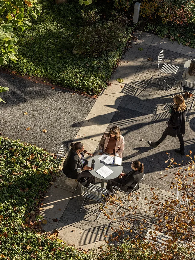 Overhead view of people sitting at an outdoor table