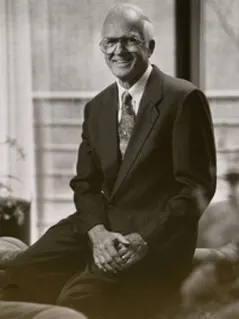 Professor Gordon Donaldson sitting on a chair