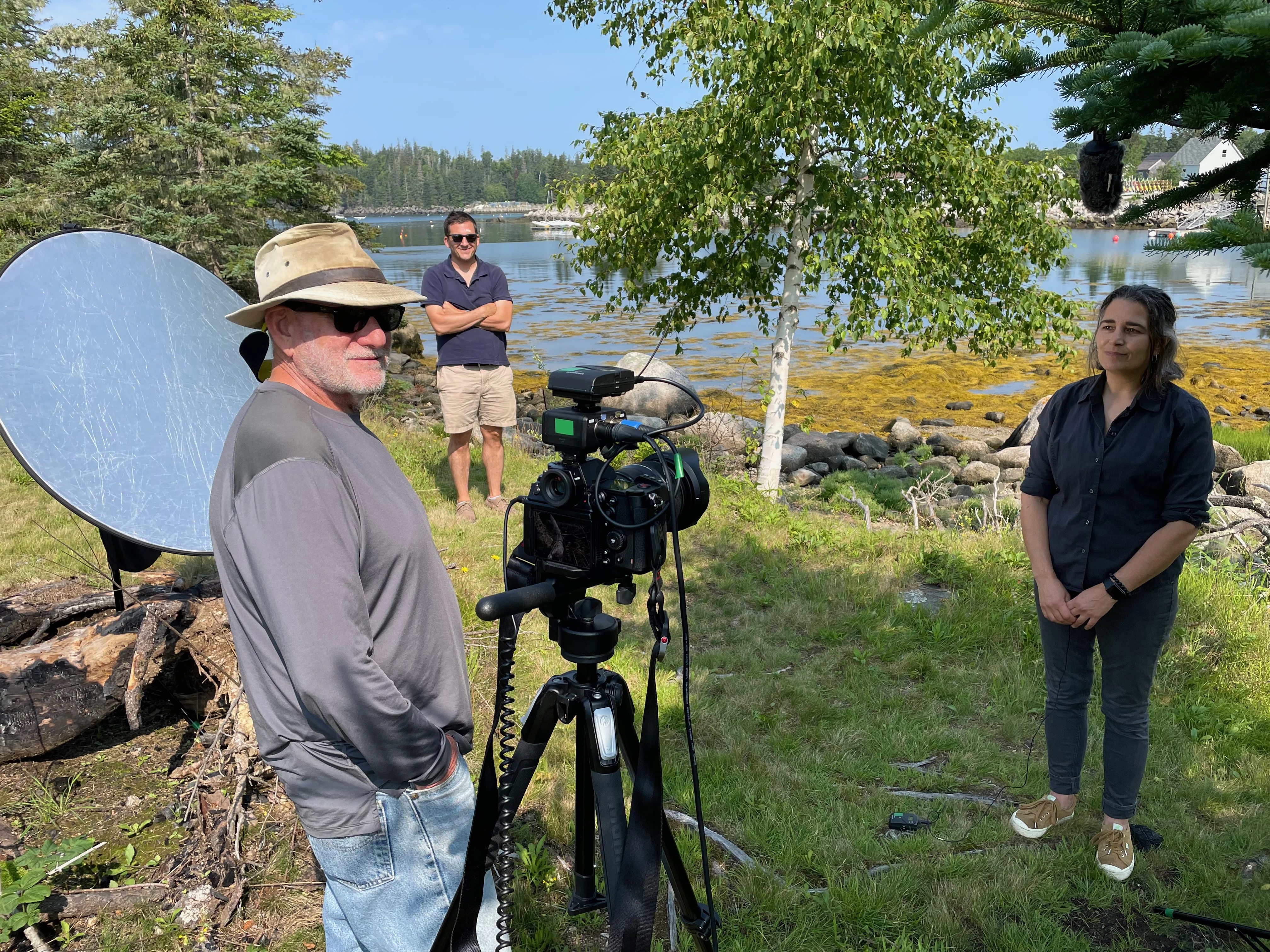 A crew filming in nature.