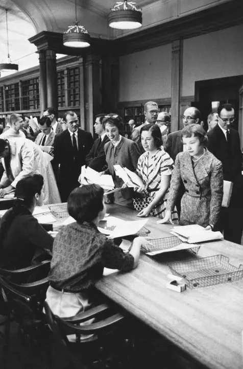 Roberta Moniz Lasley (MBA 1960), Diana C. Greer (MBA 1960), and Sara Beth Wilkinson (MBA 1960) at registration in Baker Library, 1959