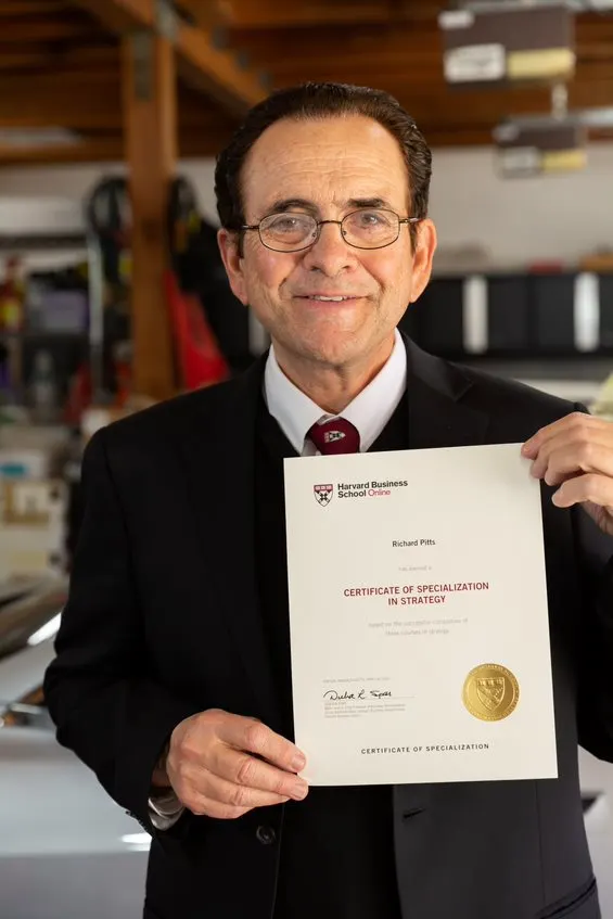 Student holding certificate