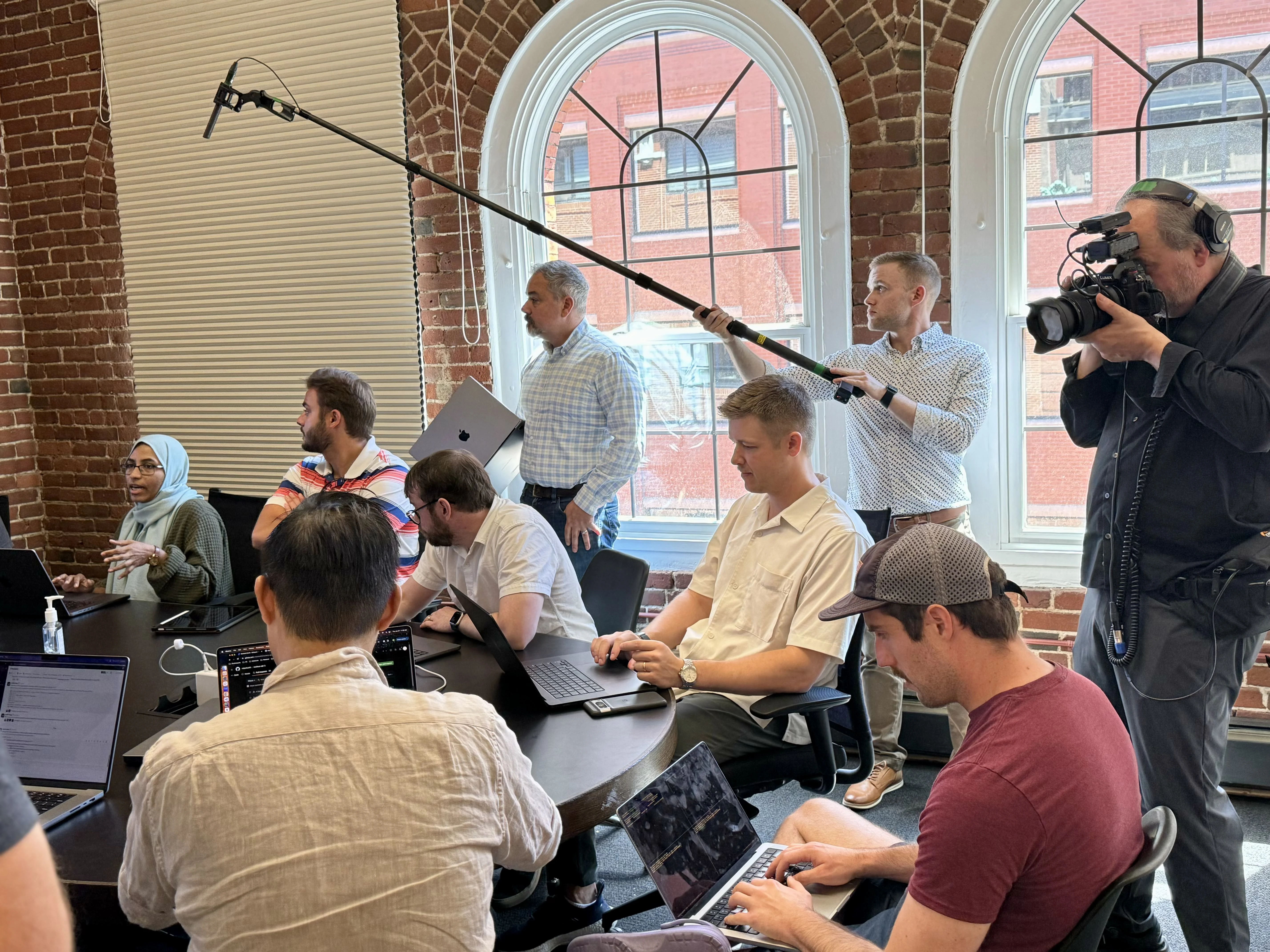 Filming in a conference room.