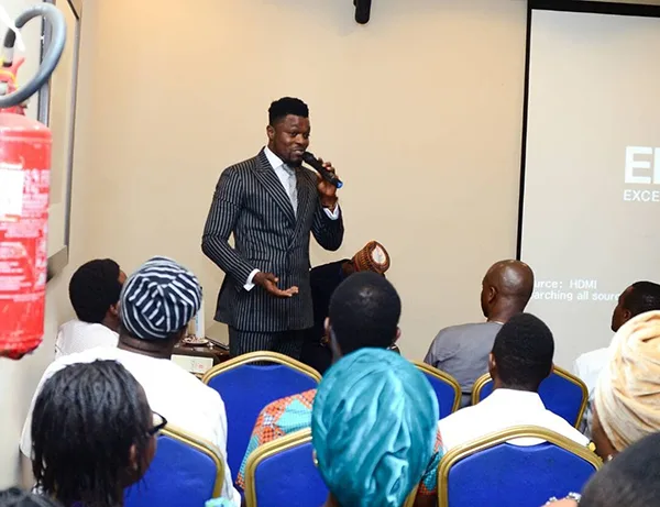 David Lanre Messan Speaking to Audience