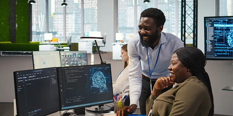A manager guiding team members as they collaborate on artificial intelligence and software development projects.