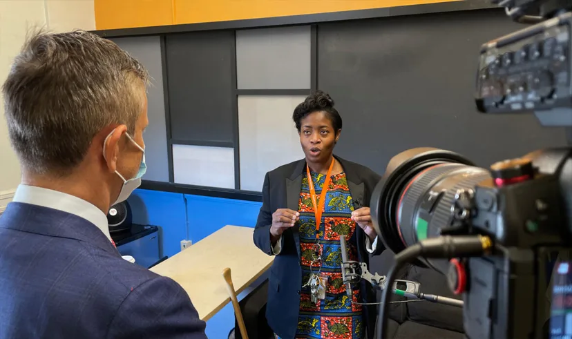 Professor Robin Greenwood on location in Harlem for the filming of the Success Academy case