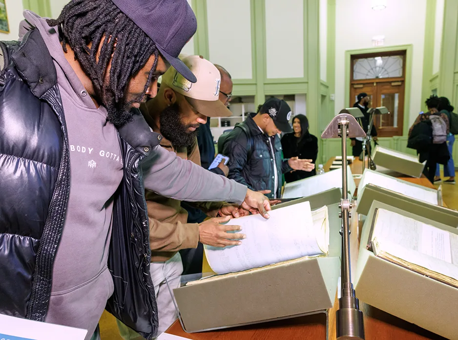 Baker Library hosts an Investing for Impact event showcasing items from the historical collections.
